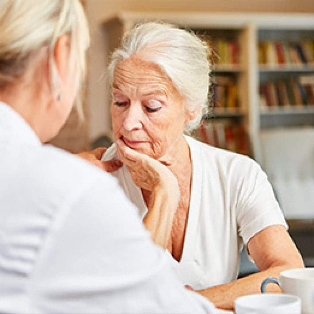 elderly woman discussing bereavement plans